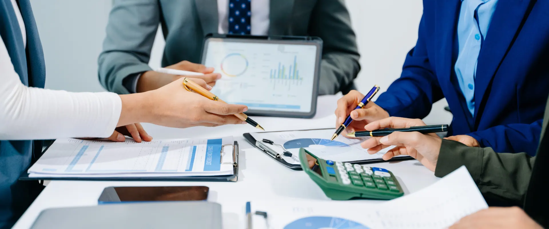 Business professionals reviewing financial reports during a planning meeting