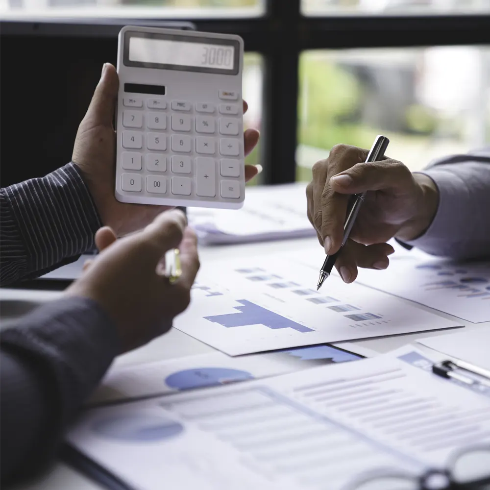 CPA reviewing financial reports and accounting calculations in Springfield, MO
