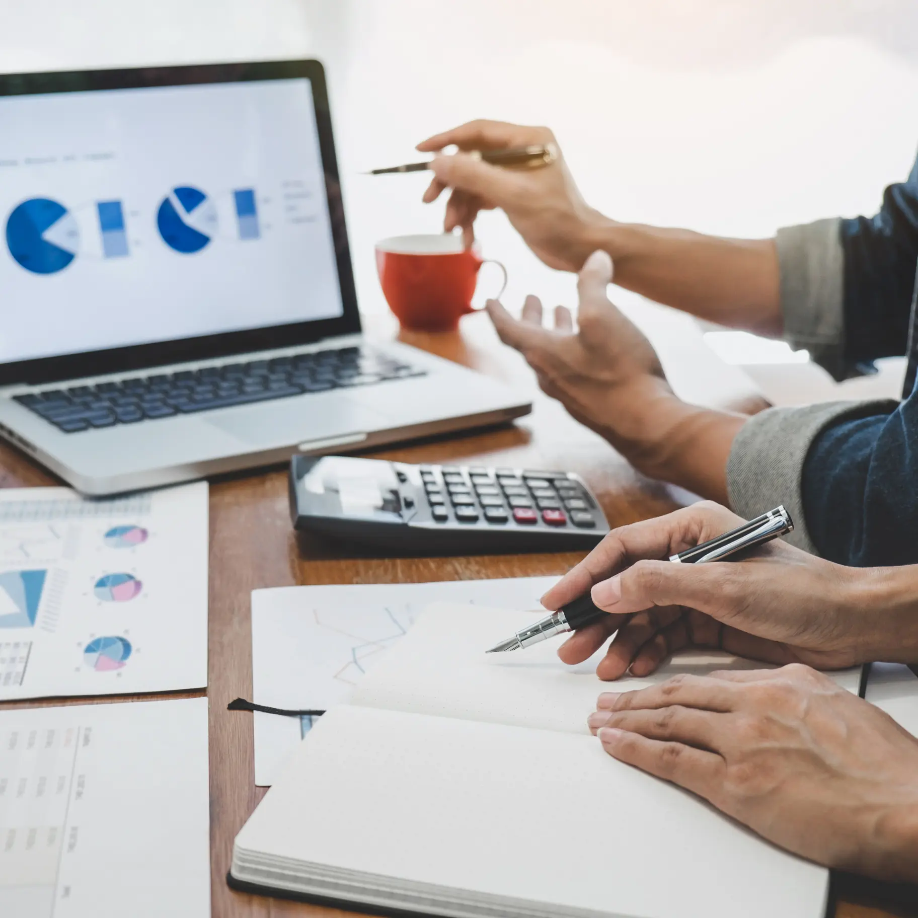 financial advisor reviewing financial plan with client office